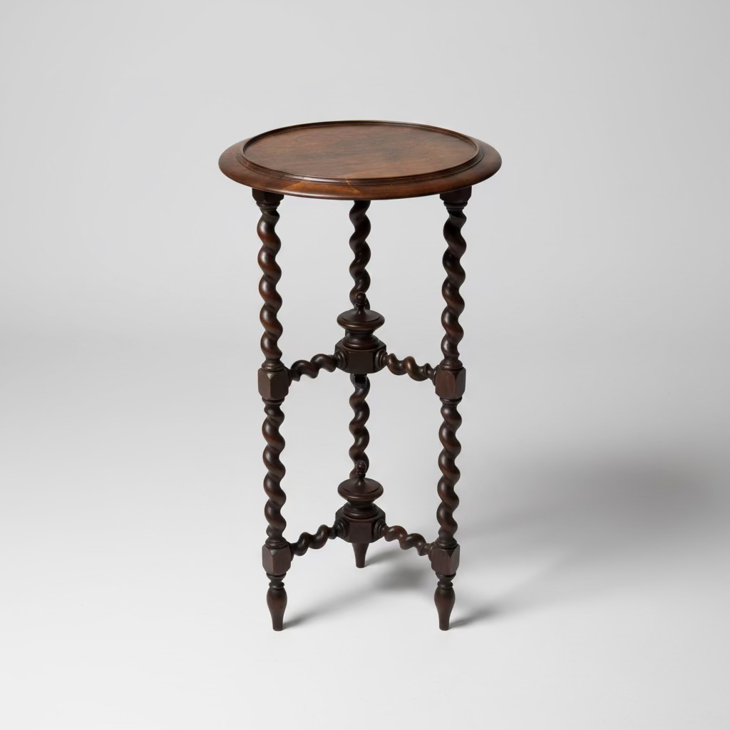 A vintage circular topped bobbin leg table with intricate wooden designs on the legs, displayed against a white background.