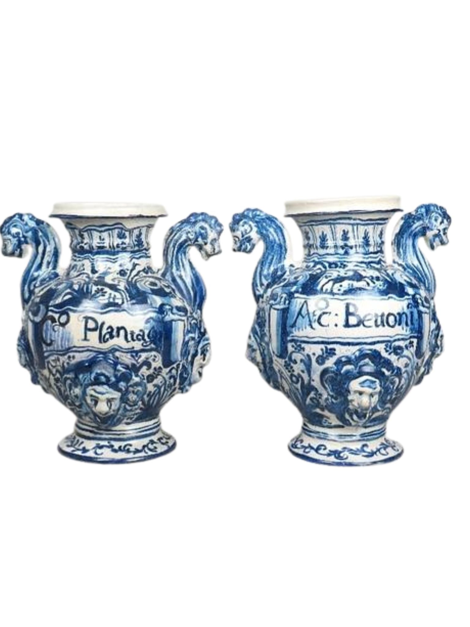 Two blue and white ceramic vases with decorative designs on a white background
