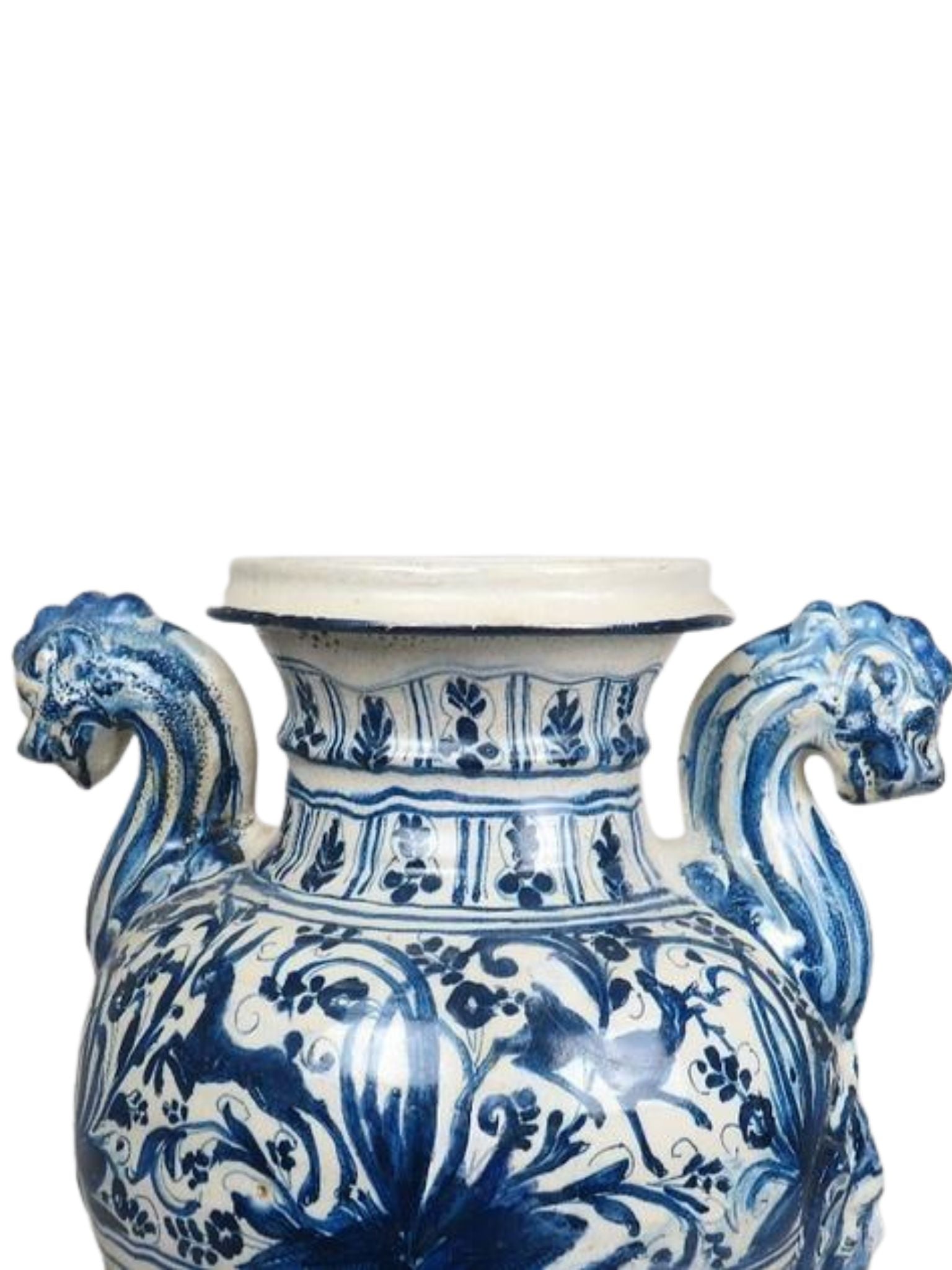 Blue and white ceramic vase with lion handles on a white background
