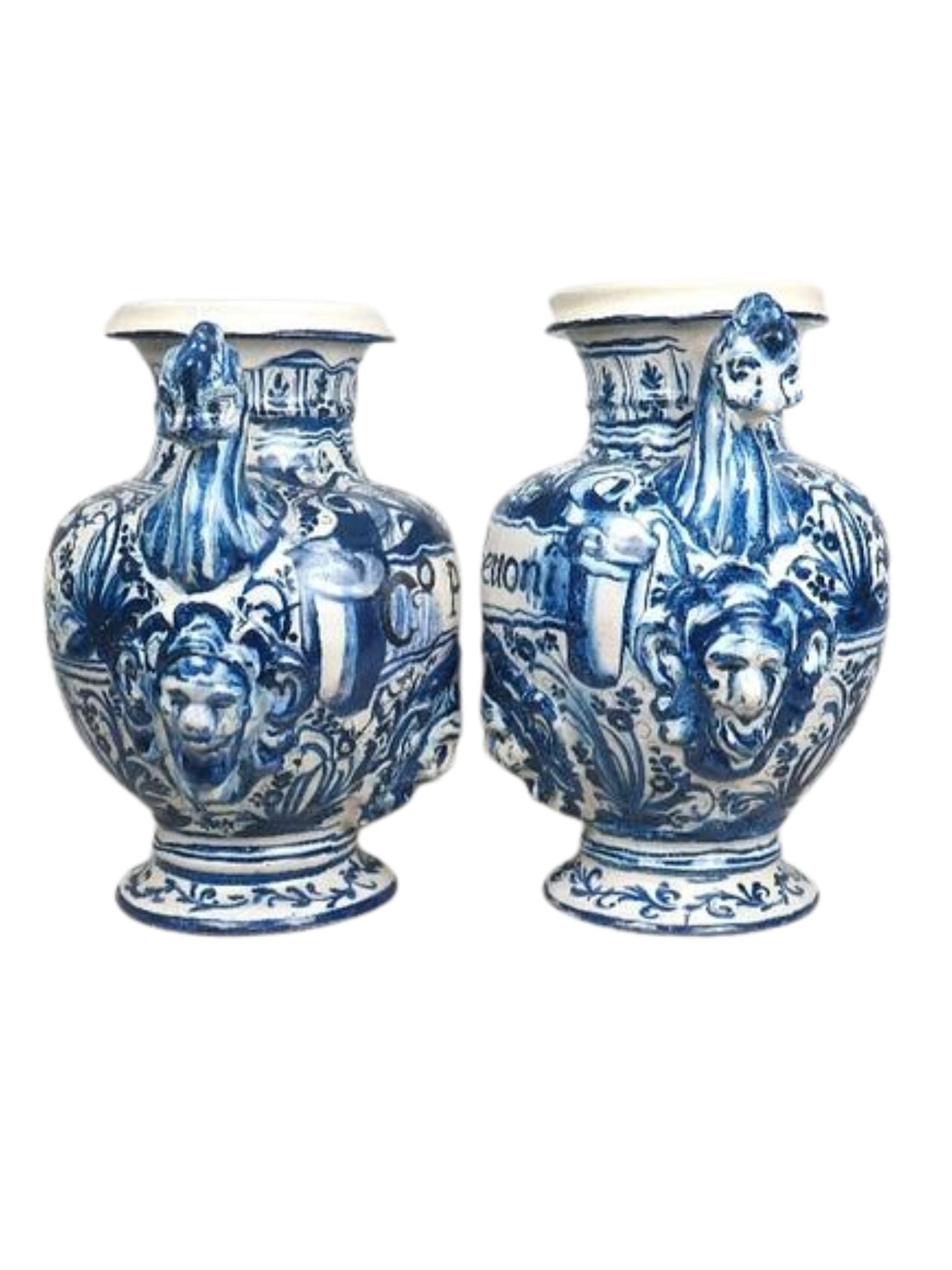 Two blue and white ceramic vases with decorative designs on a white background